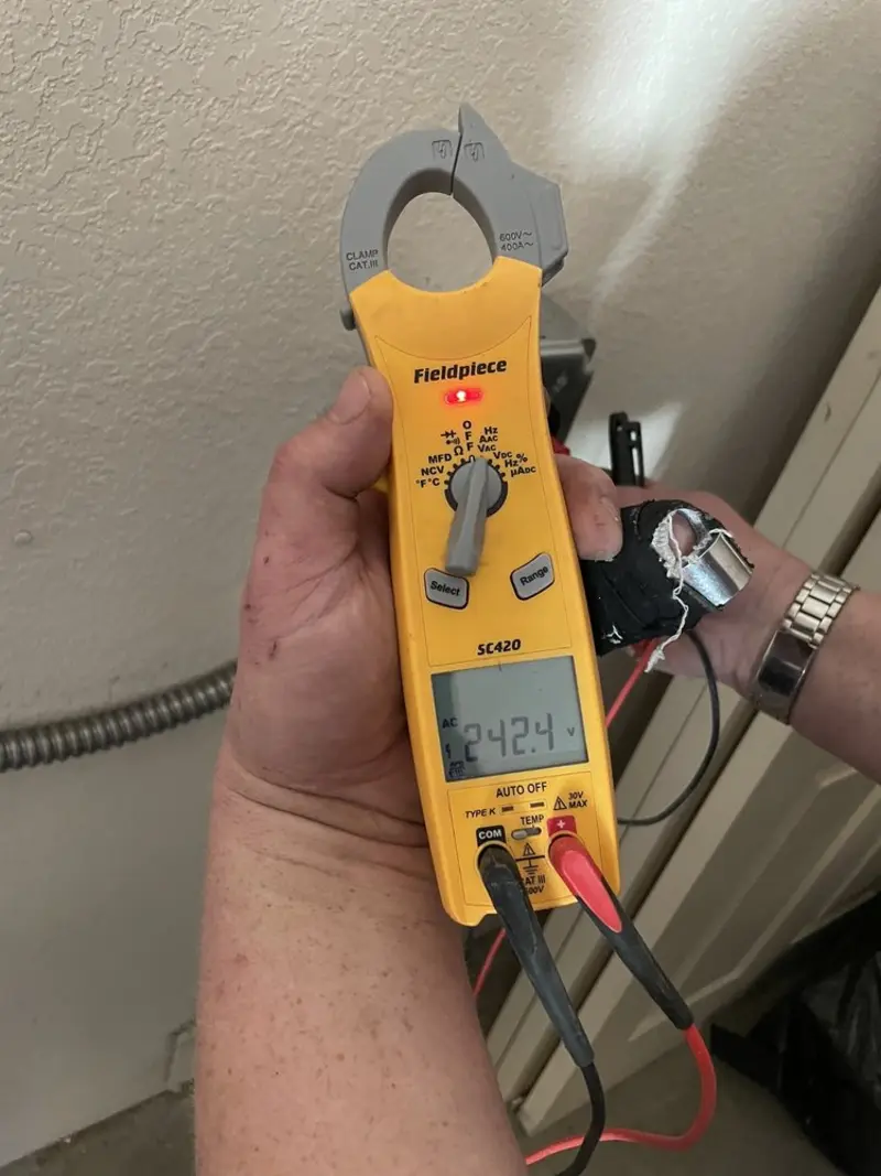 Voltage testing with clamp meter during Recessed Lighting Installation in South Fayette